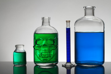 Liquid in laboratory bottles. Scientific biochemical laboratory. Colorful liquid.
