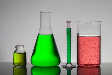 Liquid in laboratory bottles. Scientific biochemical laboratory. Colorful liquid.