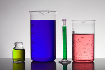 Liquid in laboratory bottles. Scientific biochemical laboratory. Colorful liquid.