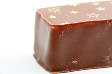 Chocolate covered marshmallow with stars on the top.