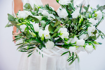 Beautiful woman with white roses wreath on white background. Springtime concept or Valentines Day holiday