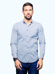 Fototapeta premium Handsome business man with blue eyes Relaxed with serious expression on face. Simple and natural looking at the camera.