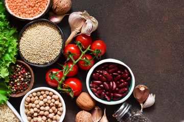 Fresh, raw vegetables on the kitchen table. Health food, clean food, choice: fruits, vegetables, seeds, superfoods, cereals, leafy vegetables. Ingredients for cooking. Top view.