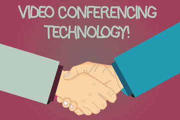 Conceptual hand writing showing Video Conferencing Technology. Business photo text People globally interacted through video data Hu analysis Shaking Hands on Agreement Sign of Respect and Honor