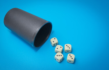 game dice on a blue background top view