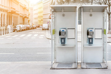Pair of payphone booth in Vienna center street. Two modern public phones on european city street....