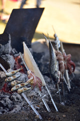 Grilled seafood on a coal hearth.