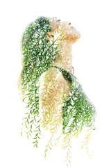 Double exposure profile portrait of a naturally beautiful happy woman and a tree with bright green...
