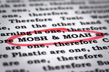 Newspaper with focus on the red marked words Mosh and moah