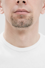 Fototapeta premium Face of a man, mouth, lips and black beard close-up.