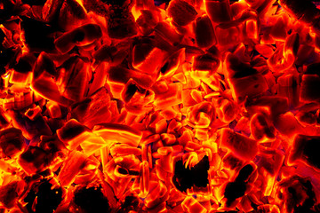 Glowing Hot Charcoal Briquettes Close-up Background Texture