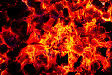 Glowing Hot Charcoal Briquettes Close-up Background Texture