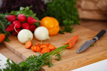 Vegetables on the desk in a kitchen .
