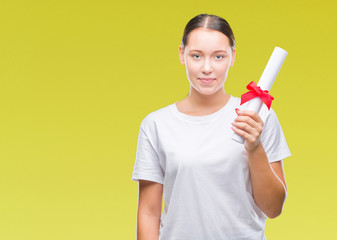 Young caucasian woman holding degree over isolated background with a confident expression on smart face thinking serious