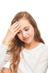 Young girl suffering from headache desperate and stressed because of pain and migraine with hands on head isolated on white background