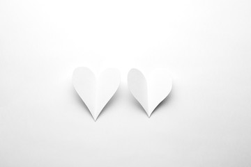 White heart on a white background cut from paper