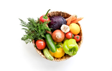  Fresh Vegetables in basket on white isolated background top view.