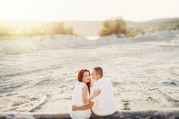 Happy young romantic couple in love have fun on beautiful beach.