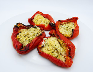 Baked red peppers stuffed with bread, parsley and olive oil