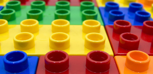 Plastic building blocks of some different colors 
