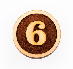 6, Number in wood - Ground organic coffee. Top view