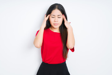 Obraz na płótnie Canvas Beautiful brunette woman wearing red t-shirt over isolated background with hand on head for pain in head because stress. Suffering migraine.