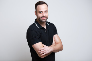 Portrait of smiling young man over white background.