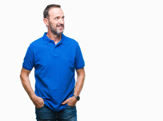 Middle age hoary senior man over isolated background smiling looking side and staring away thinking.