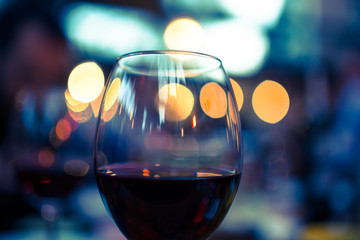 bokeh night glass of red wine valentines day
