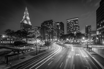 Pearl Street and modern buildings at night in downtown Hartford, Connecticut.