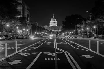 Bike lanes on Pennsylvania Avenue and the United States Capitol at night, in Washington, DC.