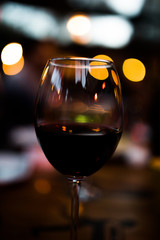 bokeh night glass of red wine valentines day