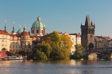Fototapeta na wymiar Prague - The to tower of the Charles bride in autumn morning.