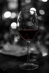 black and white glass of red wine
