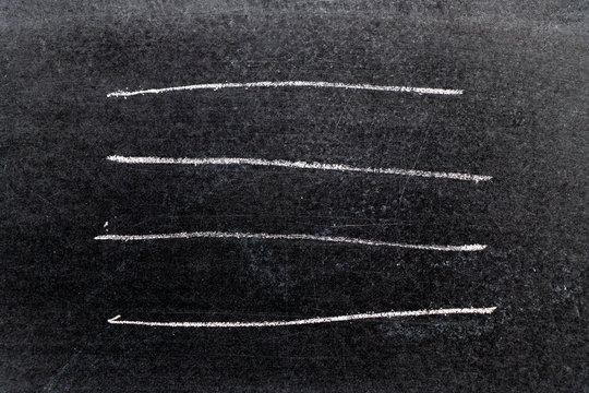 White chalk hand drawing in line shape on black board background