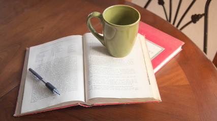 study session with books, pen, coffee on wooden table. good for students universities 