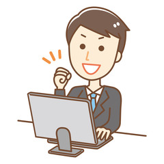 パソコンを操作する男性　ガッツポーズ