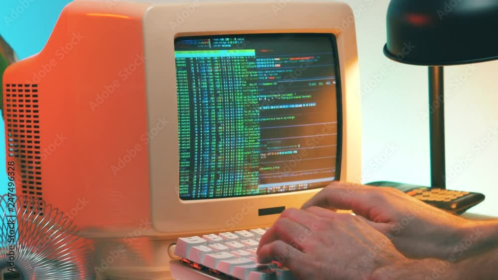 Wall mural hacker in the 80s 90s hacking a computer retro style. he even takes his vintage phone.