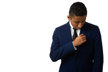 Hispanic Teenager Boy Well Dressed Isolated on White Background Fixing His Suit