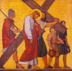 PRAGUE, CZECH REPUBLIC - OCTOBER 17, 2018: The painting Simon of Cyrene helps Jesus carry the cross...