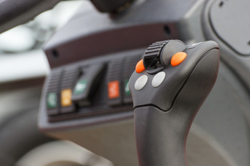 Operating control panel with buttons in truck or agricultural machine