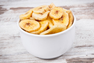 Homemade dried chips of banana for snack or dessert