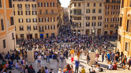Tourists sit on the Spanish Steps at Piazza di Spagna in Rome, Italy
