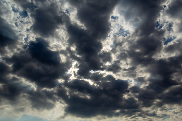 grey clouds and sun light in the centre.