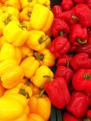 Colorful bell peppers in a basket with a super sale