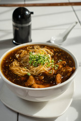 Maki Mi or pork tenderloin egg noodle in thick brown broth