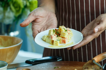 Chef,Chef working at a restaurant and making a salad,To make a salad.