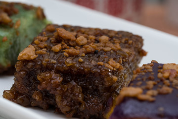 close up photo of glutinous rice cooked in brown sugar and coconut creams also called as biko