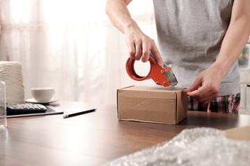 Close up of Startup business owner packing cardboard box. about shopping online.