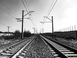 Railway lines. Road to infinity. Rails going far to horizon. Old railroad in an industrial town.